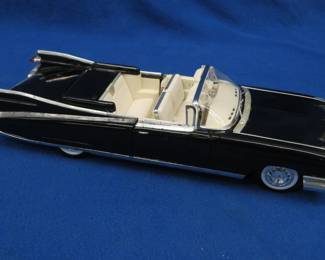 Lot 57. Maisto 1959 Cadillac El Dorado Biarritz 1:18 scale die-cast with original box and plastic display case