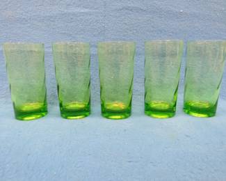 Lot 199. 1950s-era green tumbler-style swirl glasses