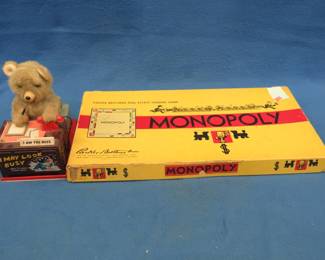 Lot 377. Vintage Monopoly game and battery-operated bear boss toy.
