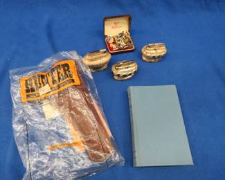 Lot 23. New Hunter size 4 leather holster, three lighters, and a book