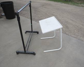 Lot 274. Portable adjustable table and a clothing rack