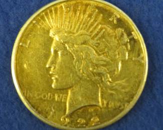 Lot 92. 1922 S gold-colored Peace silver dollar