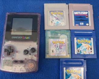 Lot 308. Nintendo Game Boy Color with games and a case in a Rubbermaid container