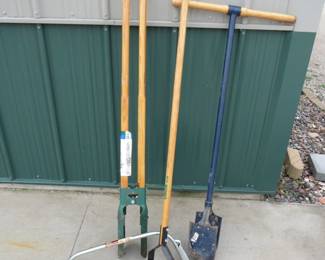 Lot 275. Long handled tools and a bow saw