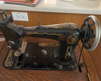 Betsy Ross antique sewing machine in amazing condition! In its original oak cabinet!