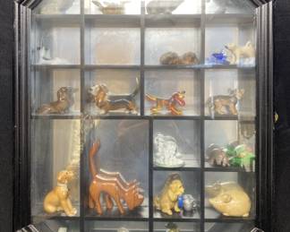 MIRRORED DISPLAY CASE WITH ASSORTED DECOR FEATURING HAND CARVED AL MYERS FIGURINE AND HAND PAINTED BANK FIGURI