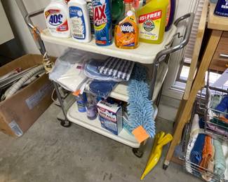 many cleaning products & utility cart
