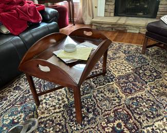 Table with glass and rugs for sale