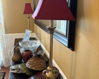 Beautiful table, matching lamps with matching red shades and cord covers. 