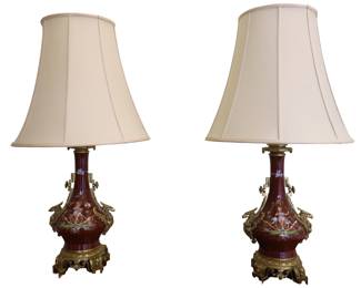 Set Of Burgundy Porcelain Lamps Featuring Griffin Head Handles