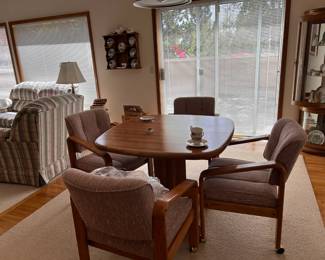 Nice table with one leaf and has wheels, 4 chairs as-new $225.00