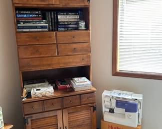 tall cabinet two doors on bottom, two doors on top with drawers