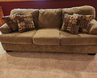 Sofa with decorative pillows 36 x 86 x 36 great condition located in basement