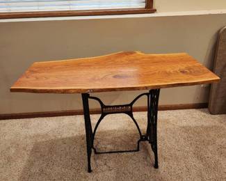 Finished raw wood table top with iron Singer base 29 x 47 x 27 very nice located in basement