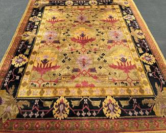 TUFENKIAN TIBETAN HAND LOOMED CARPET | Black gold and pale green with geometric devices; oriental hand-knotted wool rug. - l. 142 x w. 104 in