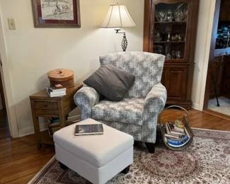 Quaint reading nook chair and ottoman, vintage sewing box, end table with USB connection