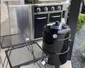 Grill (fair condition but still works fine)includes full propane tank metal side tables brand new smoker