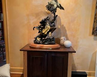 One of 50 bronze. “Brave heart”48”tall on custom cabinet made 1997. By Vic Payne