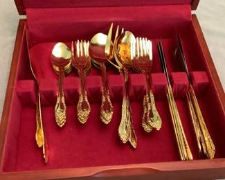Gold tone flatware set with case