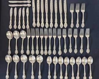 Several sets of sterling silver flatware
