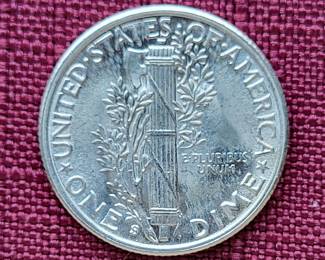 Many silver dollars and other coins and currency