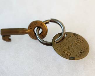 Chicago, Milwaukee St. Paul & Pacific Railroad items. Early 1900s brass tapered hollow barrel key and rare local baggage tag by Wilcox (local means the tag and baggage should not leave the home road). The key is marked Effelholz & Company.