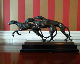 Bronze statue three running dogs