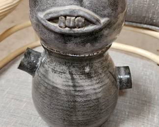 Artsy stone wear figurine signed Wade