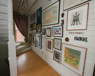 Gallery wall hallway FULL of framed original artworks