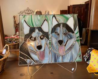 Decorative stained glass depicting a pair of happy Huskies.