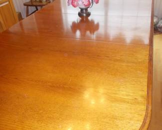 Dining table shown with 2 leaves  