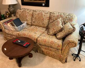 Sofa in living room, small round occasional table 