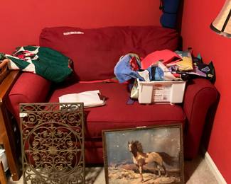 Red chair actually pulls out to a twin bed! Horse picture & vintage metal art