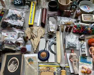 Hundreds of “smalls” (small collectibles), including vintage ephemera, coin banks, dolls, and more.