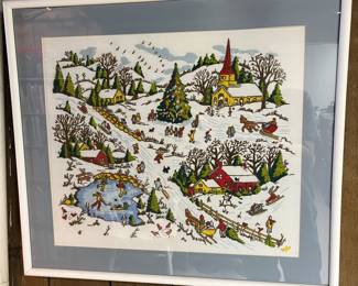 Custom-framed needlework showing a village winter/Christmas scene.