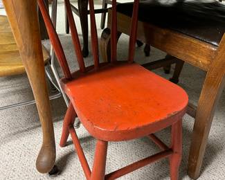 Vintage wood child’s chair, painted red.