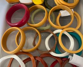 Many vintage bracelets, including some bakelite.