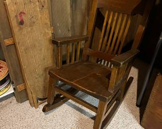 Vintage rocking chair and antique ironing board.