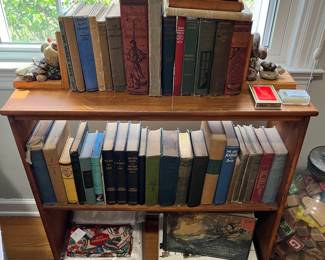 Compact bookshelf; selection of vintage/antique books.