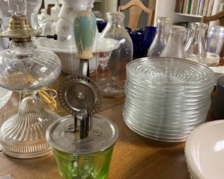 Metal and green depression glass hand mixer/beater; large selection of vintage glassware.