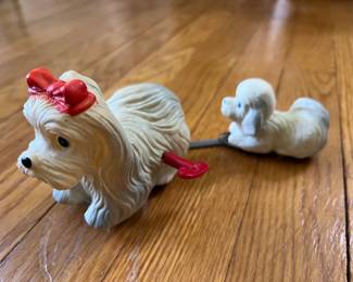 Vintage wind-up tin toy dog with pull-along puppy.
