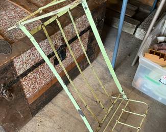 Antique metal frame for a doll’s bed.