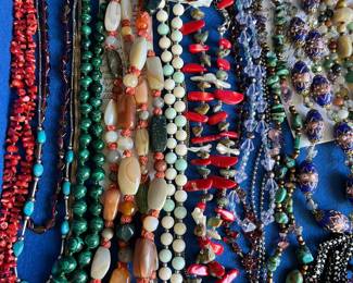 1,000+ pieces of jewelry to be sold, including many designer/signed pieces, sterling silver, jade, coral, bakelite, and more. This photo shows a sampling of the vintage necklaces to be sold.