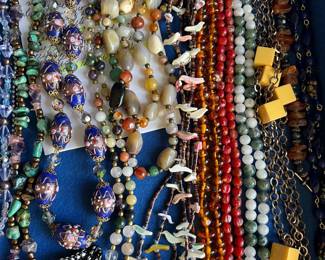 1,000+ pieces of jewelry to be sold, including many designer/signed pieces, sterling silver, jade, coral, bakelite, and more. This photo shows a sampling of the vintage necklaces to be sold.