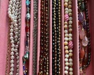 Hundreds of pieces of vintage jewelry, including many designer necklaces.