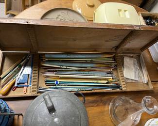 Vintage knitting needles and tools/accessories in an interesting wood box.