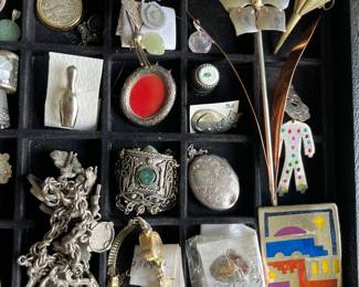 Sampling of the large selection of sterling silver jewelry and smalls to bd sold.