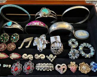 Hundreds of pieces of sterling silver jewelry and designer/signed costume jewelry.