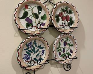 #107	4 plate iron wall hanging w/fruit plates.	 $ 20.00 																							