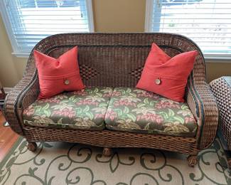 #8	3 piece wicker outdoor furniture w/ tropical cushions and 3 additional pillows. 1 Loveseat, 1 seat, and 1 side table w/ glass top. Loveseat: 64"x22"x35". Single Seat: 35"x22"x34" Side Table:  24"x30"x20.5"	 $ 300.00 																							